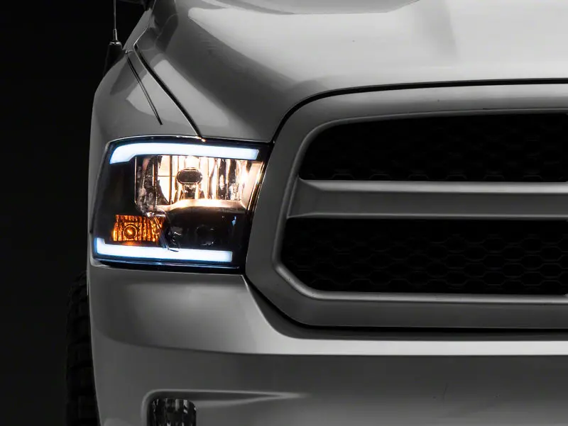 Raxiom 09-18 Dodge Ram 1500/2500/3500 Axial Series Headlights W/ Led Bar- Blk Housing (Clear Lens) 1