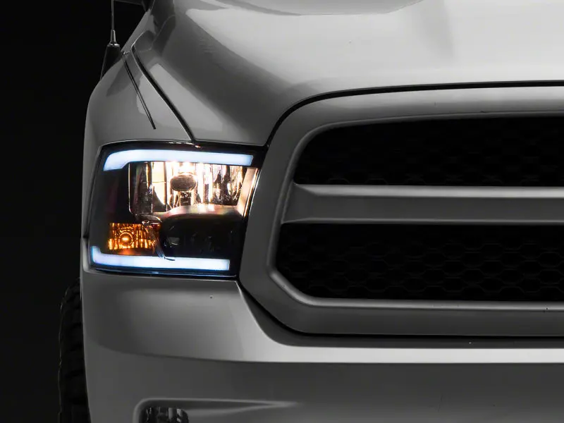 Raxiom 09-18 Dodge Ram 1500/2500/3500 Axial Headlights W/ Seql Led Bar- Blk Housing (Clear Lens) 1